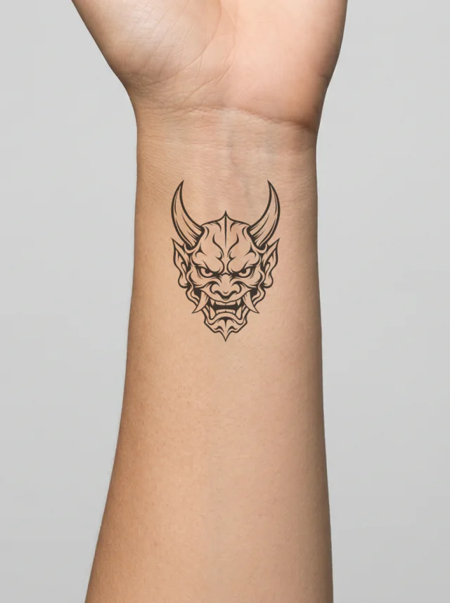 Minimal Oni Mask Emblem Retaining Two Horns Tattoo on-skin preview