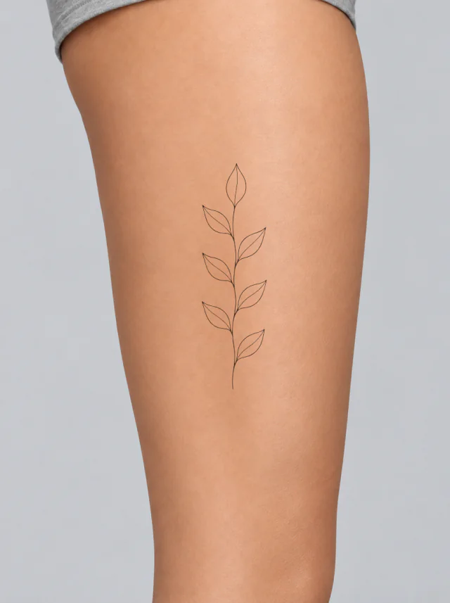 Minimalist Vertical Leaves Thigh Tattoo on-skin preview