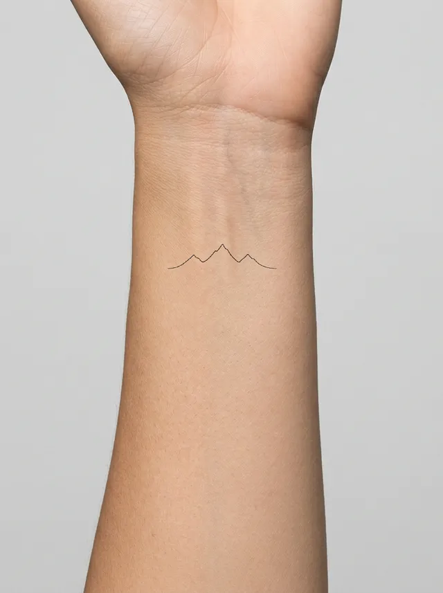Minimalist Mountain Ridge Wrist Tattoo on-skin preview