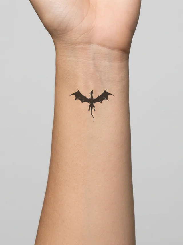 Angular Wing Dragon Silhouette Tattoo on-skin preview